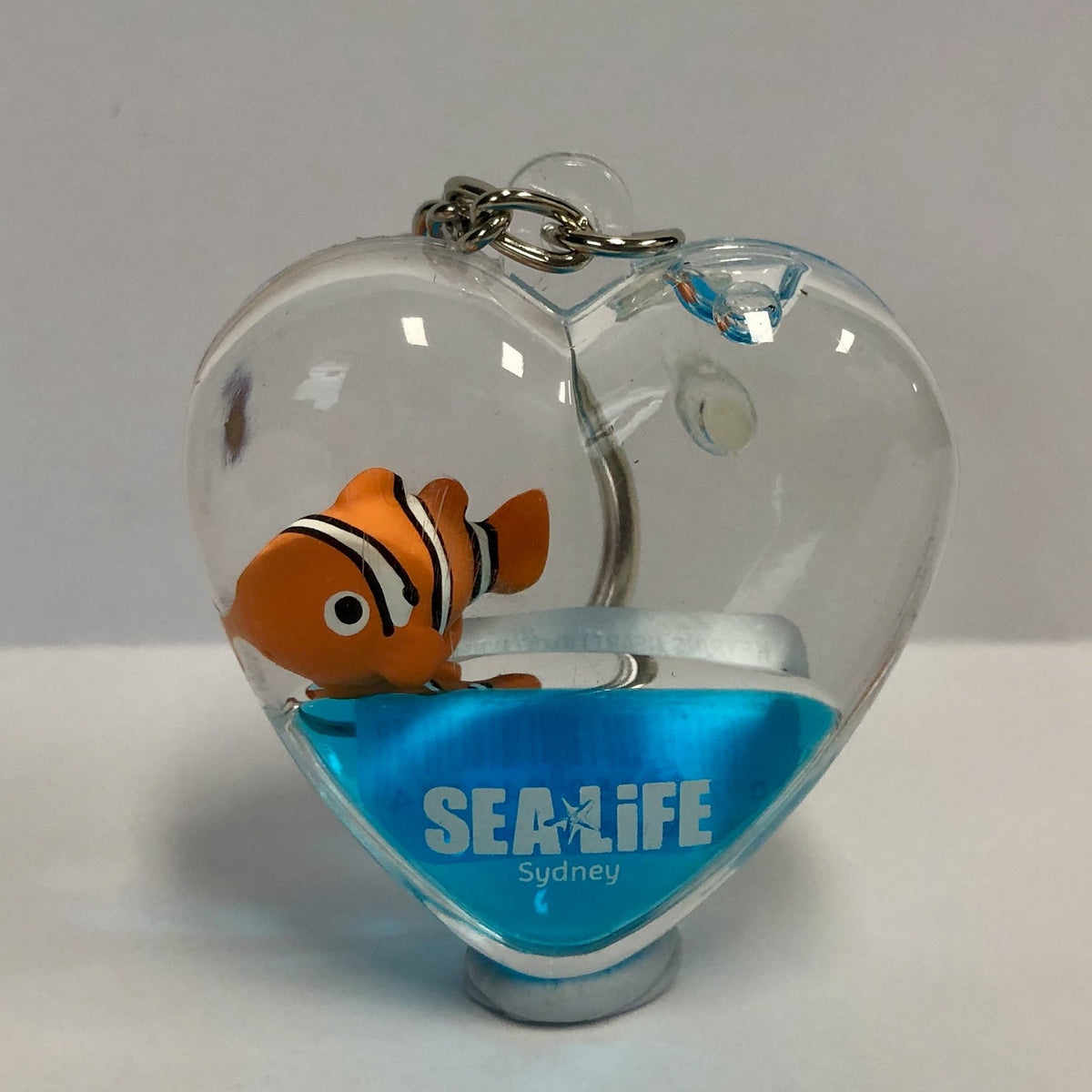 SEA LIFE Sydney Heart Shaped Keyring with Clownfish in Blue Liquid ...