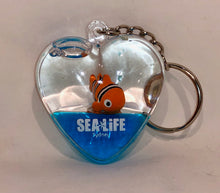 Load image into Gallery viewer, SEA LIFE Sydney Heart Shaped Keyring with Clownfish in Blue Liquid
